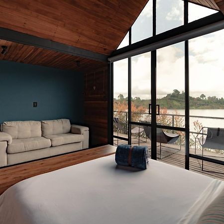 The Boato Hotel Guatape Exterior photo A bedroom in a house