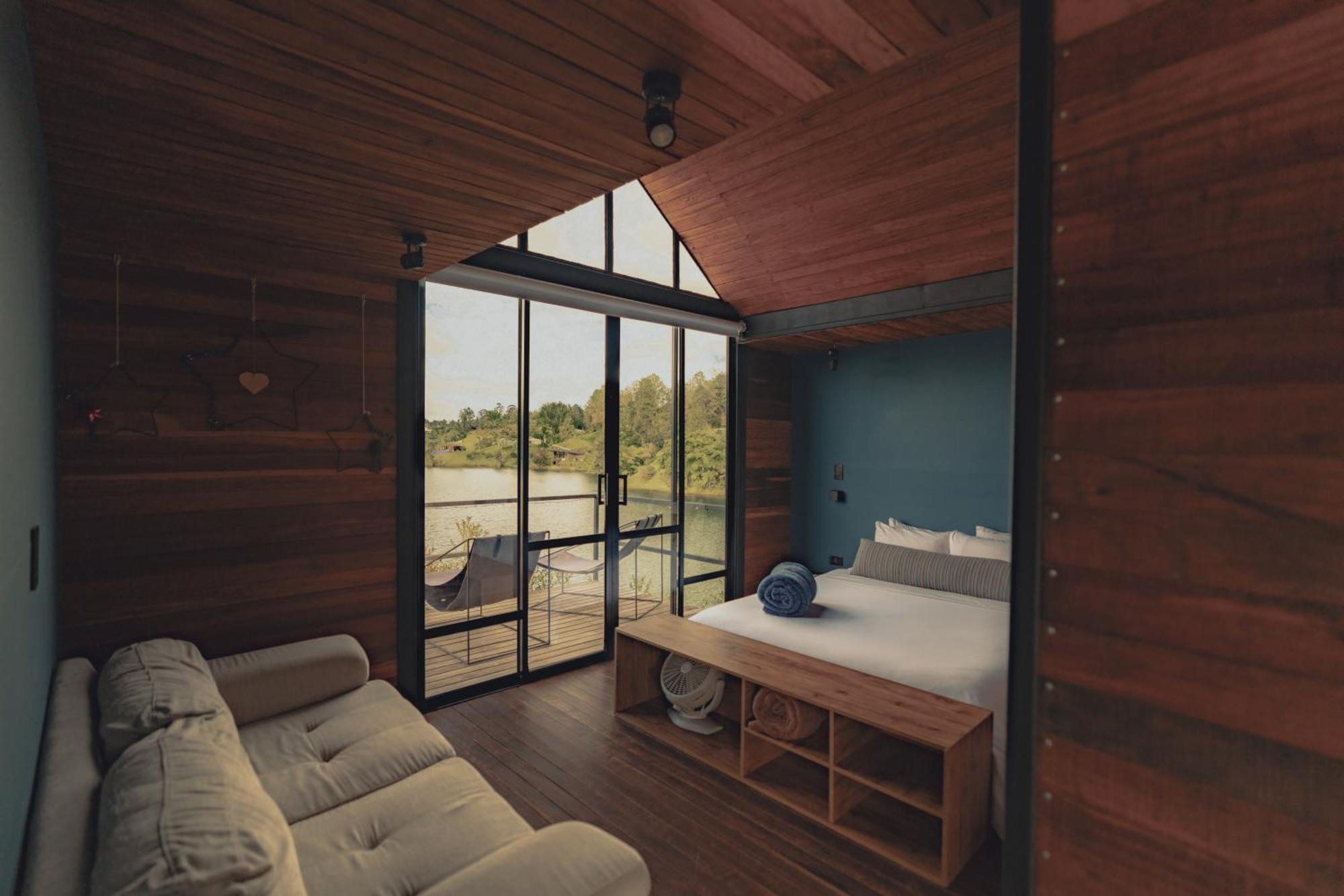 The Boato Hotel Guatape Exterior photo Interior of a cabin