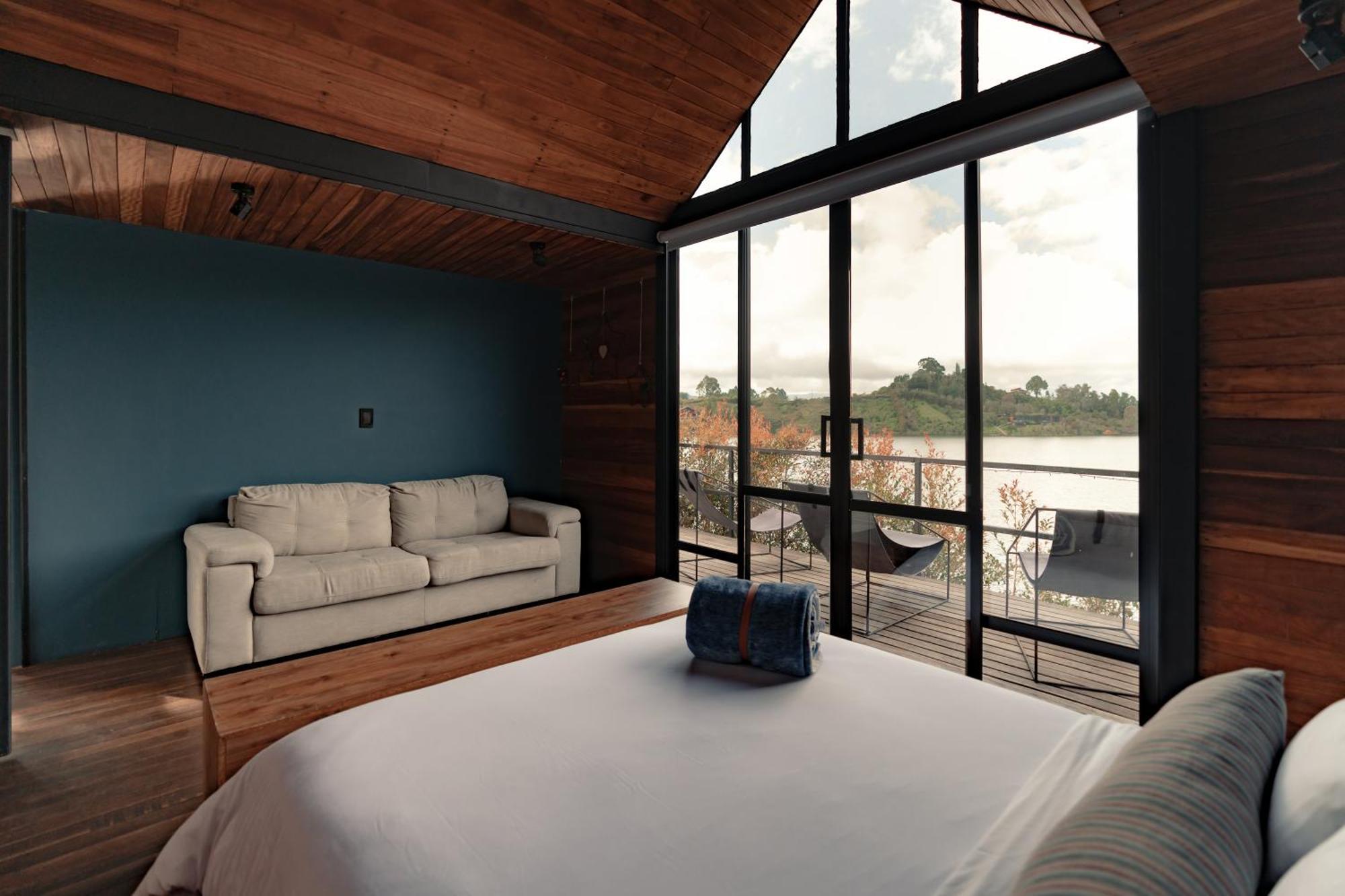 The Boato Hotel Guatape Exterior photo A bedroom in a house